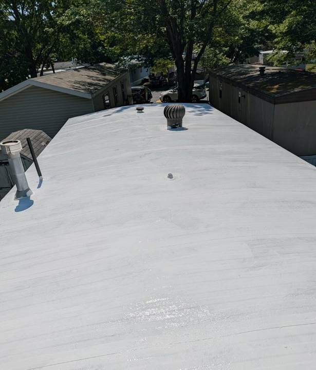 Completed manufactured-home roof with white reflective coating
